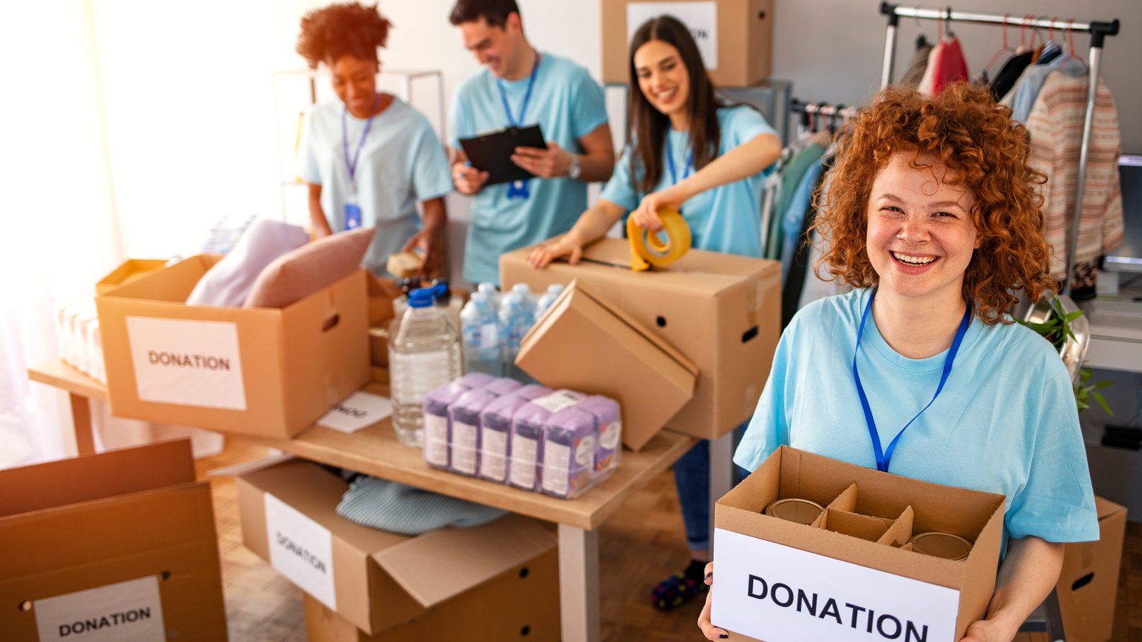 Image shows charity organization volunteers. The right tools for nonprofits are essential for these heroes of the charitable industry.